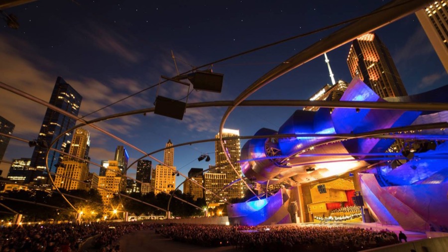 Grant Park Music Festival at the Jay Pritzker Pavilion at night, Chicago skyline behind